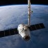 A SpaceX Dragon capsule is connected to the International Space Station's Canadarm2 prior to its release. The Dragon capsule has successfully completed 6 resupply missions to the ISS with a perfect safety record.