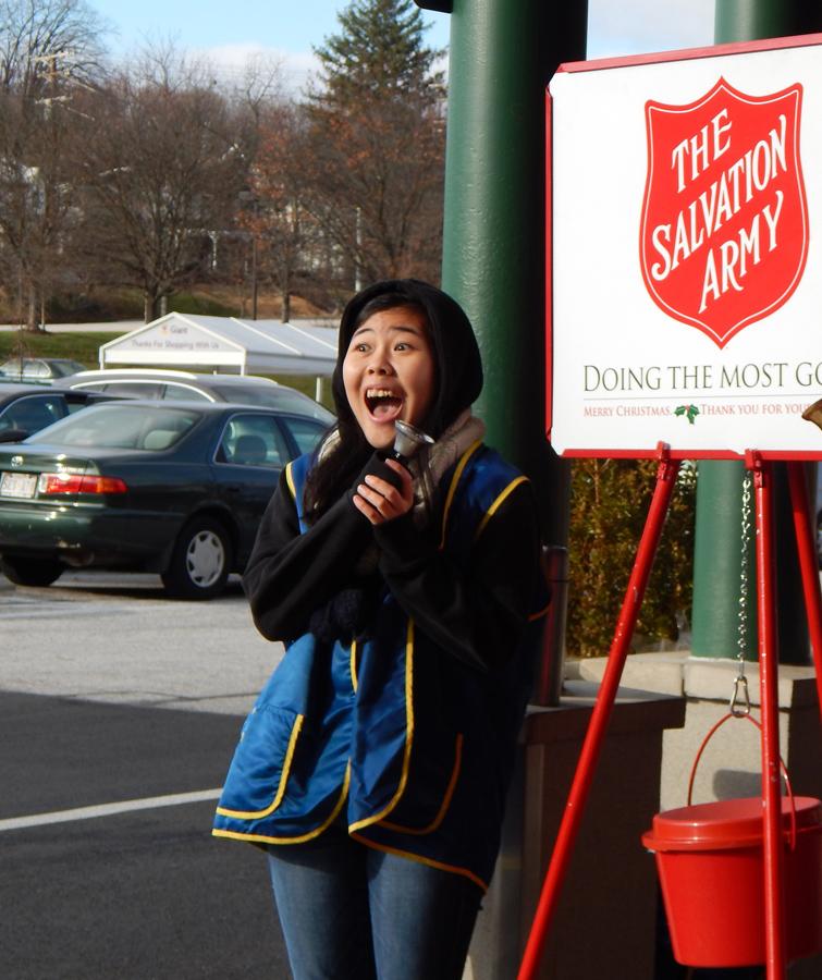Sophomore Sunny Kim solicits donations during a Key Clube Salvation Army bell ringing event Dec. 7 at Hunt Valley Giant. Other Key Club events this season include gift wrapping at St. Vincents Villa and Santagrams.