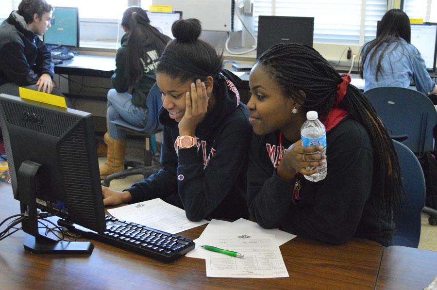 Seniors CeCe Ukejiana and Michelle Njau (front, left to right) take a marketing test for the Future Business Leaders of America regional competition while junior Finn Hasson, sophomore Ellie Jackson and freshman Francesca LaRocca (back, left to right) focus on their specific portion of the test.  Students took the different tests after school on Jan. 29 in order to be placed among other FBLA members for the next round of competition at Hereford High School on Feb. 11. 