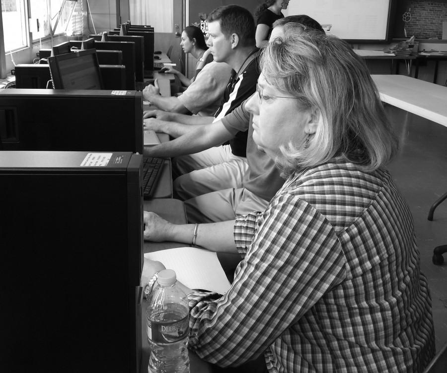 Math teacher Lynette Roller, science chairman Steve Shaw, science
teacher Ned Lyons and history teacher Rachel Baikauskas
participate in Naviance training,
earning each one point toward the 12 they need by the end of the school year.
