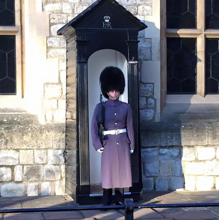 A member of the ceremonial Coldstream Guards stands guard outside the Tower of London.