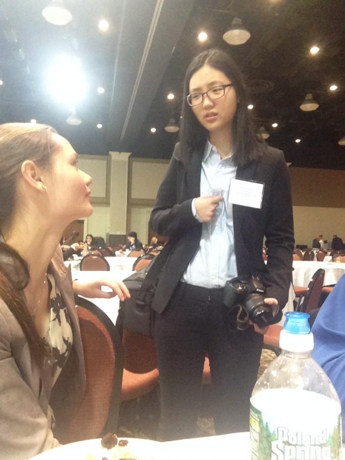 Senior Laura Hillard, one of three Model United Nations presidents of our delegation, gives sophomore Eunbin Choi advice about her speech for a chair position Jan. 11. Choi ran for committee chair of  Social, Humanitarian and Cultural Affairs Committee B, the same position that Hillard ran for last year as a junior. 