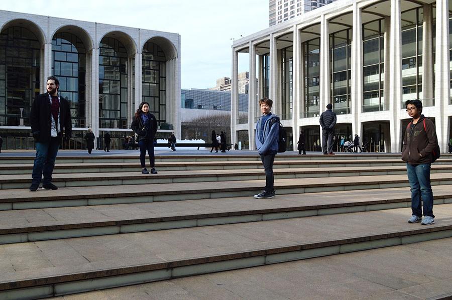 (left to right) Chaperone Abdullah Ali, freshman Ashley Kimmell and Calvin Penaflor and sophomore Joodh Waldeedh stand at the steps of Lincoln Center. 