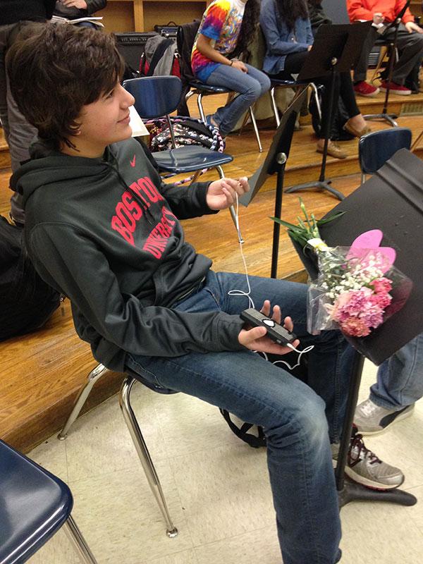 Freshman James Pentikis is found in guitar teacher Brian Dickson’s homeroom with a card and bouquet of flowers. The card was signed anonymously. 