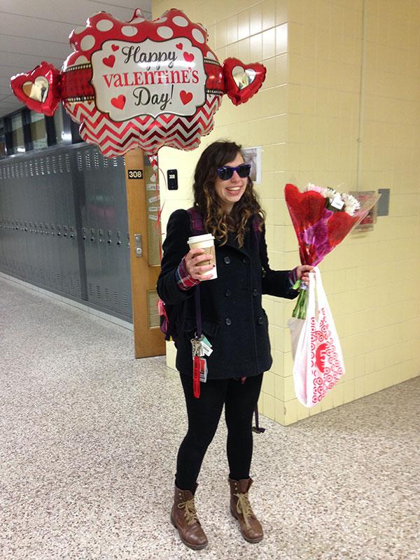 Senior Morgan Larocca strolls down the hallway, followed by her Valentine’s Day balloon, holding a starbucks coffee in one hand and a bouquet of flowers in the other. Her boyfriend, senior Preston Hamrick, gave her the gifts this morning. 
