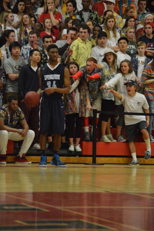 Fans attempt to distract a Springbrook player during the regional championship game held on March 9 at Dulaney. 