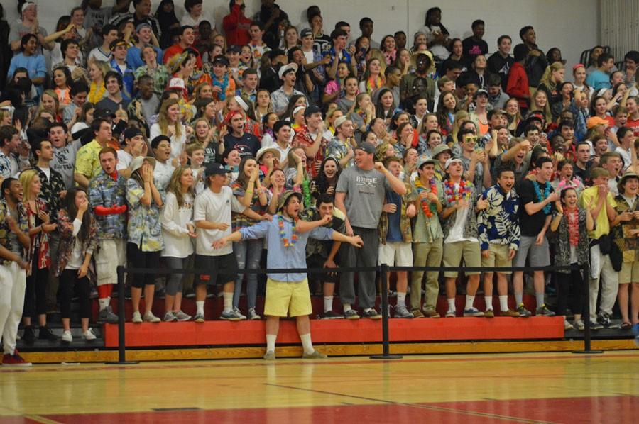 Fans react to a blocked pass during the fourth quarter of the varsity basketball home game. 