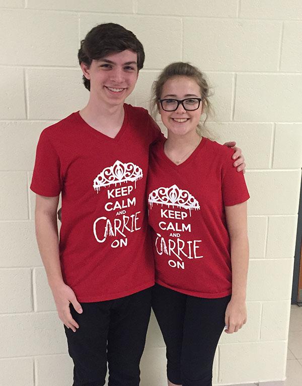 Senior Emma Bartels-Jones and sophomore Daniel Longest pose in their Carrie shirts, promoting the upcoming play. Carrie will be held in the auditorium Mar. 26 - 28 at 7:30 pm. Tickets are $10. 