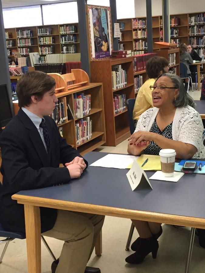 Junior Patrick Nolan listens to his interviewer’s questions before responding. Junior Interviews were held in the Library March 18 and 19.