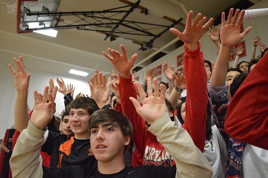 Junior Jake Bellinger and Senior Benneit Heit hold up their hands during a free throw. 