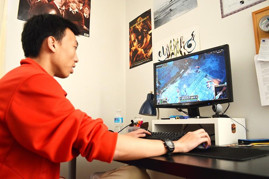 Junior Yiyi Kuang plays League of Legends in March. He called the relationship between viewers and content creators symbiotic.