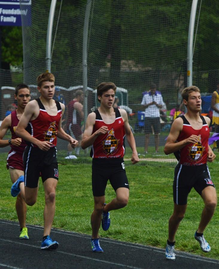 Juniors Andrew King and Sean Smyth and senior Adolfo Carvahlo compete in the varsity boys 1600m finals at the Baltimore County Outdoor Track and Field Championship at Pikesville High School on May 8. Carvahlo, Smyth and King earned 2nd, 3rd and 4th, respectively. 