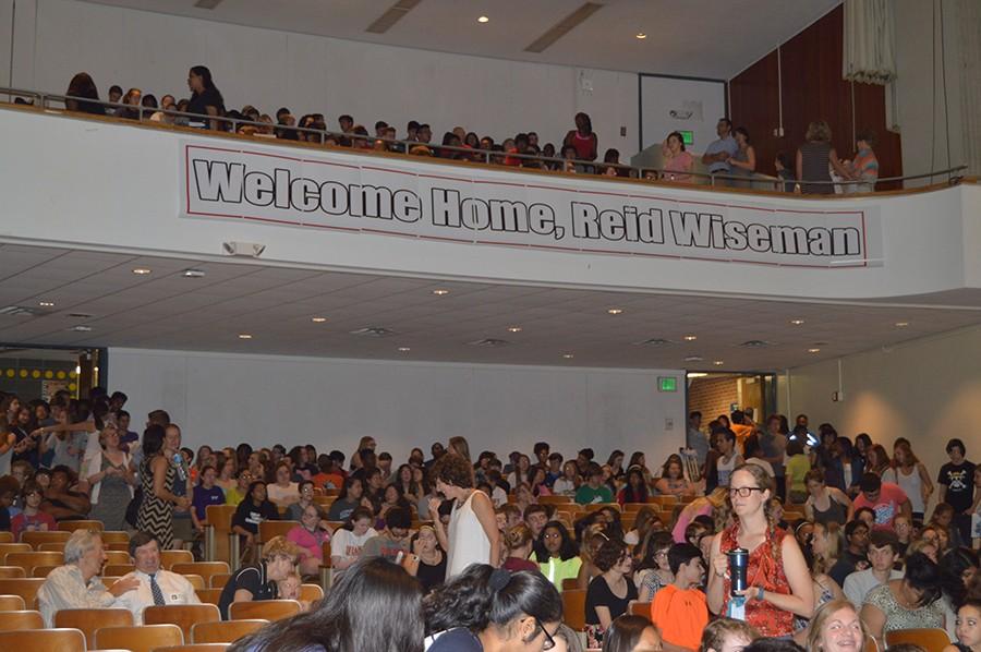 Students take their seats in the auditorium prior to the first assembly. The Advanced Placement Physics class organized the event, decorated the auditorium, and distributed signs for Wiseman. 