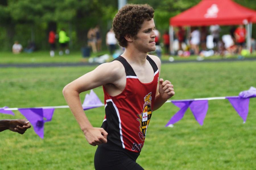 Junior Eric Walz passes contenders in the varsity boys 3200m Baltimore County Track and Field Championship finals on May 8. Walz received first team All-Metro honors for this past indoor track season.