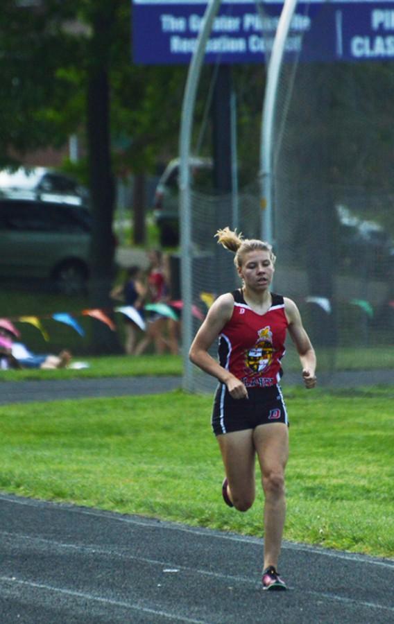 Junior Kristin Meek runs in the varsity girls 800m finals. In herr 3rd meet since recovering from her injury, Meek placed 4th.   