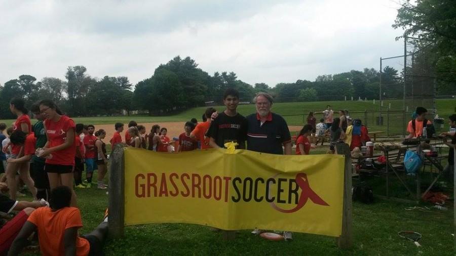 Dulaney High School junior, Arshad Fakhar, one of the organizers of the event, poses with event speaker Gerhard Friedrich, whose son co-founded the Grassroot Soccer Organization.