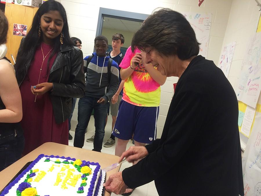 Skelton cuts a cake during a morning celebration of her retirement. 