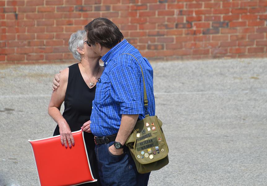 Class of 1971 alumni Debbie Gill and John Gogoll kiss before approaching the rocks Aug. 30.  
