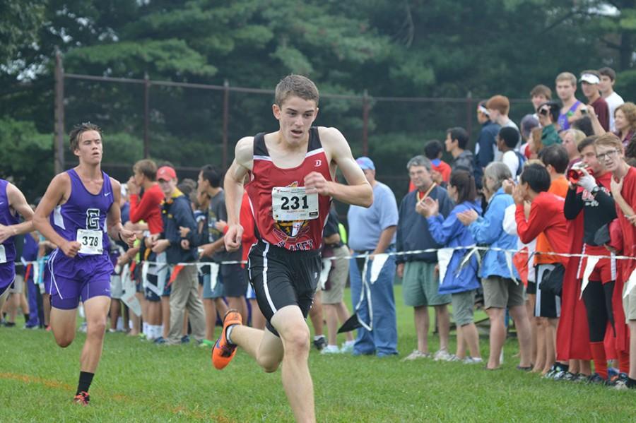 Sophomore Alex Ozbolt pushes towards the finish line during the varsity race. Ozbolt earhed 26th place, just seven spots ahead of teammate, junior Drew Persinger. 