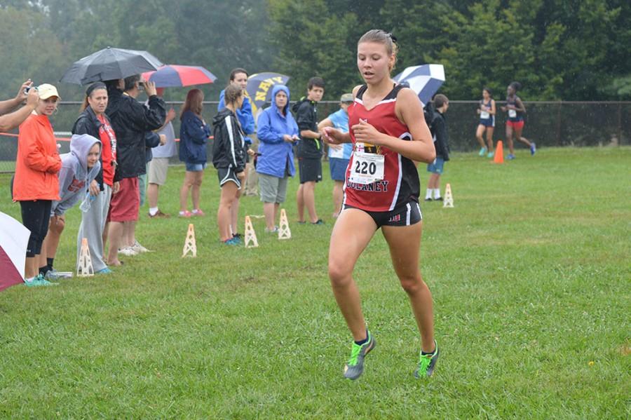Senior Kristin Meek reaches the finish line in fifth place, behind competitors from Paint Branch, Towson and Hereford.