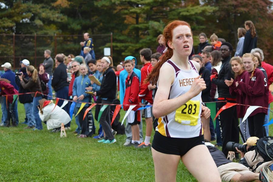 Hereford senior Sarah Coffey crosses the finish line with a first place time of 18:25.70.