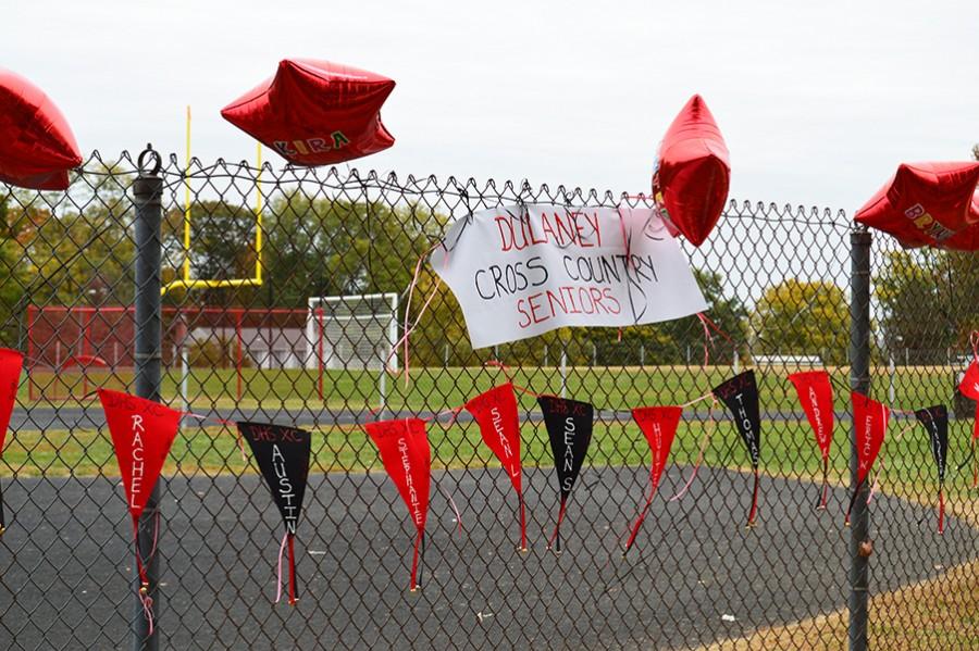 Decorations celebrating the cross country teams senior members hang on the gate here at the Oct. 24 Baltimore County Cross Country Championship. 