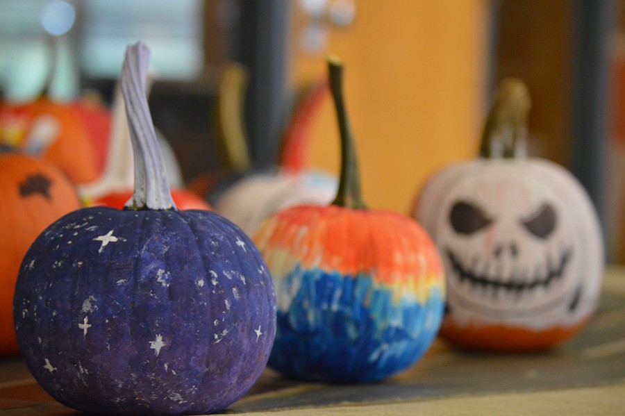 Pumpkins decorated by National Art Honors Society and Art Club members rest in the office lobby Oct. 27. 