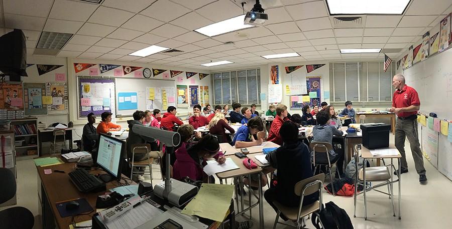 Students in math teacher Steven Binko’s 2B Gifted and Talented Algebra II class take notes on the day’s lesson Dec. 1. “A bigger class is a larger amount of work, especially with a class that has more challenges and more discipline problems,” Binko said.