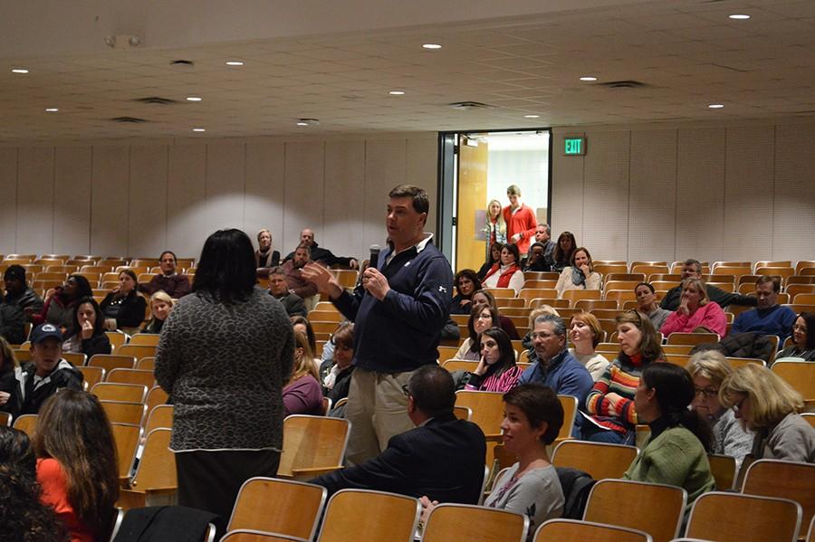 James Pezzulla, a parent, shares his and his childrens experiences with the recent renovations at Ridgely Middle School. He and his wife Ann, who also spoke, expressed concern over having to go through the process again.