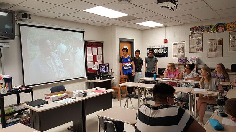 Juniors Peter Hong, Taelon Um and Shreeyad Pant show an episode of The Fresh Prince of Bel-Air to Julie Marxs Period 3B Advanced Placement US History class June 2. Students were tasked with choosing a TV show that represented a past decade. 