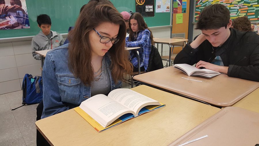 Sophomore Shannon Tragesar reads  “Brady, Brady, Brady: The Complete Story of the Brady Bunch as Told by the Father/Son Team who Really Know” by Sherwood and Lloyd J. Schwartz in Alicia Drechsler’s 2B Honors 10 English class Feb. 14.