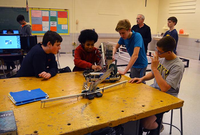 One of the schools robotics teams prepare for the state championship after school Feb. 28. Six teams here qualified for the event, which will take place March 4 at Dundalk Technical High School.  