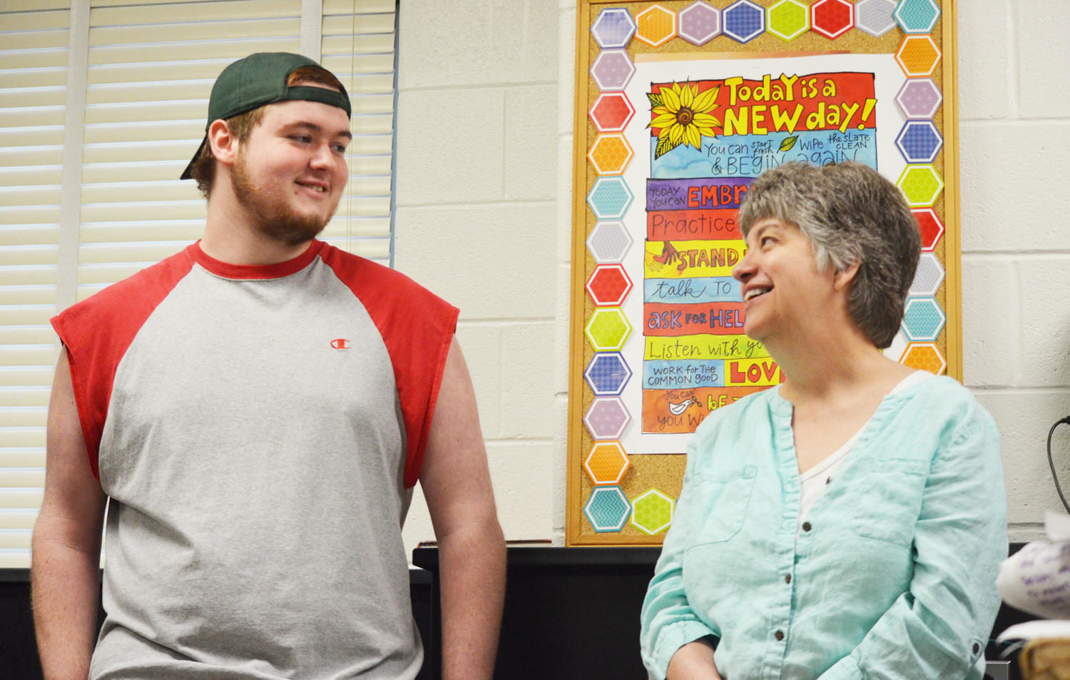 Davidson and science teacher Laura Braly catch up after first period in room 216 May 11. “[Braly] taught my paramedical biology class, which is what pushed me to major in biology,” Davidson said. He will attend Stevenson University.