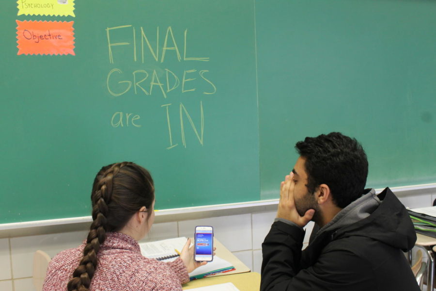 Seniors Madi Sedgwick and Sepehr Akhtarkhavari stress over final quarter grades in room 103 Nov. 9. Akhtakhavari described the anxiety grades cause as overwhelming .“The pressure of schoolwork and responsibilities makes you want to curl up into a ball and cry,” he said