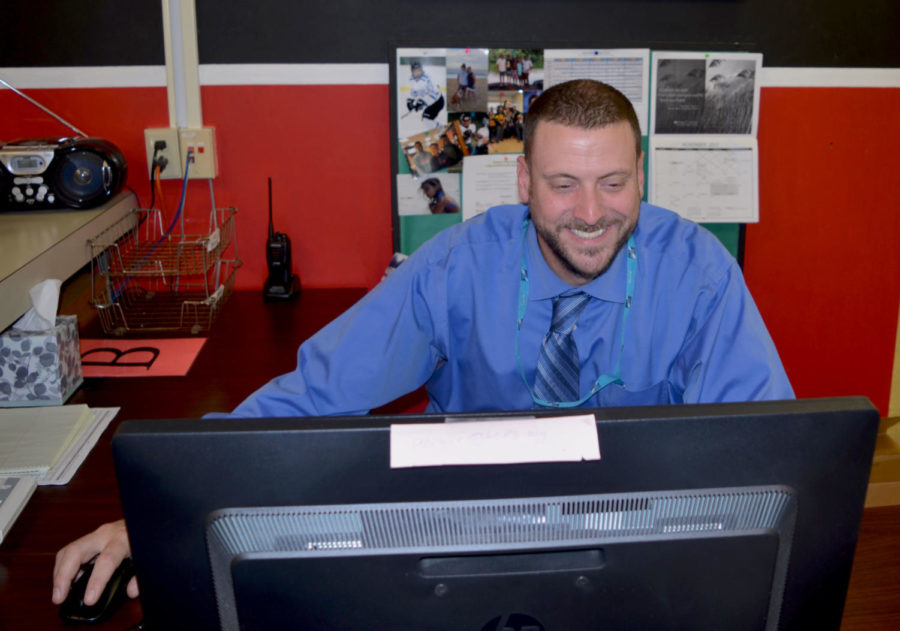Principal Samuel Wynkoop works at his desk Nov. 13.