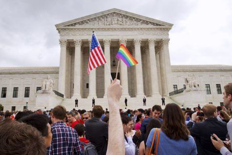 The crowd celebrates outside of the Supreme Court in Washington, Friday June 26, 2015, after the court declared that same-sex couples have a right to marry anywhere in the US. 