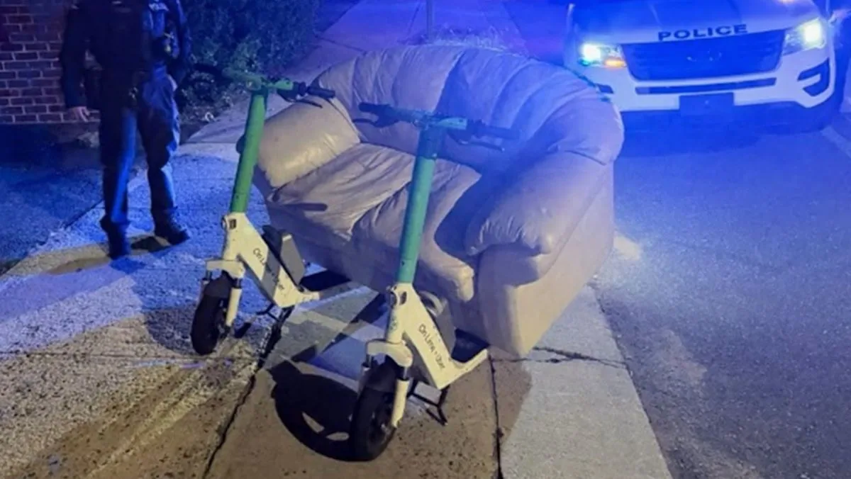 Charlotte Police Stop Two Men Riding a Couch Mounted on Electric Scooters Down South Tryon Street and Warn the Homemade Setup Was Probably Unsafe